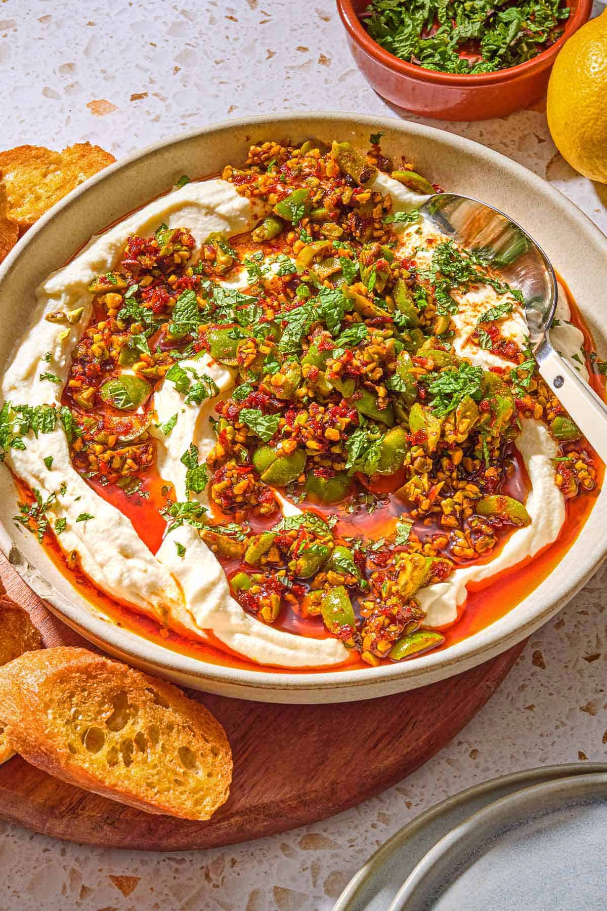 Whipped Ricotta Dip with Pistachios, Olives, and Harissa Oil